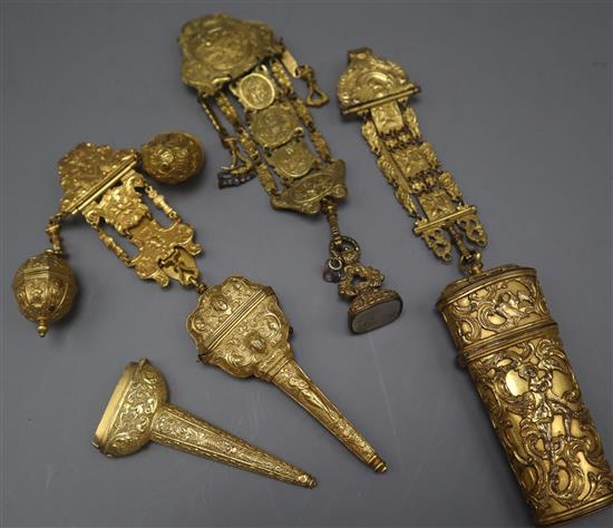 An 18th century gilt metal chatelaine with seal attached and two other chatelaines